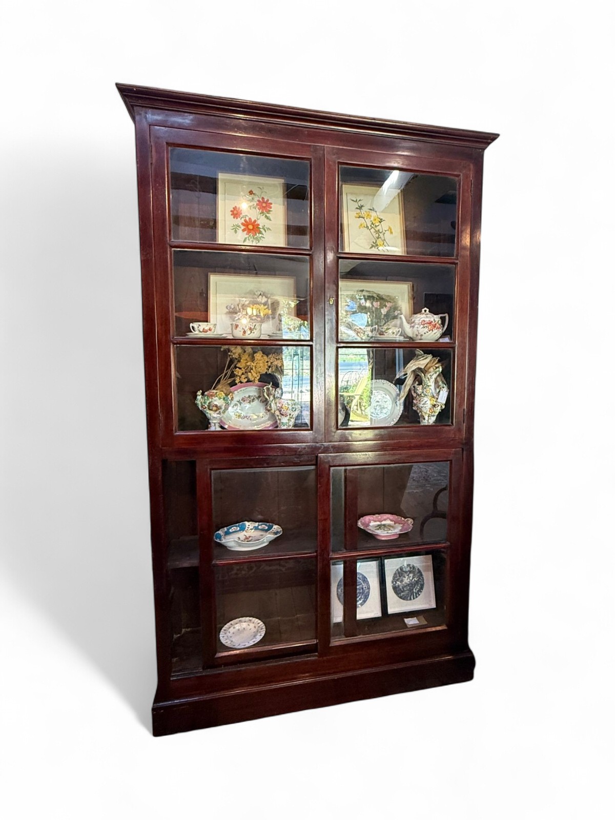 Mahogany bookcase with glass doors.